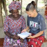 Alicia T. Singham Goodwin '14 working with Takpaya Justine, a community health worker