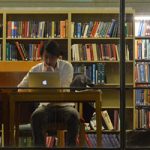 student in library