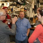 Professor J. Kim Vandiver, Mark Belanger, and others celebrate the Edgerton Student Shop's move across Vassar Street. The new shop is next door to the Metropolis Shop, part of Project Manus.