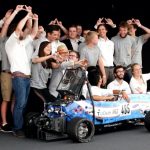 MIT Driverless and TU Delft pose with their race car, DUT18, at Formula Student Germany 2019. The joint team placed third overall.