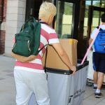 A family helps to move their student into Maseeh Hall in August 2019.