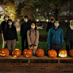 Caption:An October coffee hour event incorporated a pumpkin-carving activity.